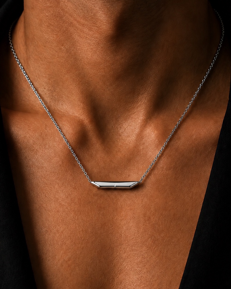 The same necklace in polished silver, worn on the chest
